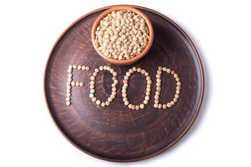 Grains of lentils on a plate.