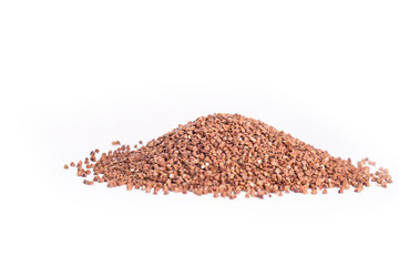Heap of buckwheat on a white with copy space