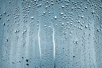 texture of large and small drops of water on a matte surface with color shades