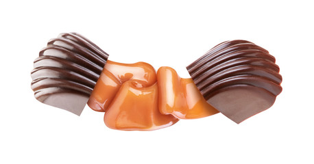 chocolate candy with liquid caramel on a white background