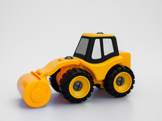 Yellow road roller truck isolated white background.