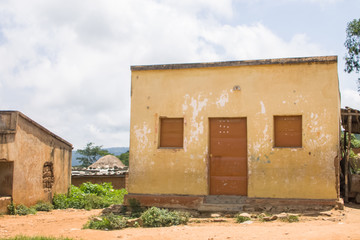 View of traditional village, thatched and zinc sheet on roof houses and terracotta brick walls,...