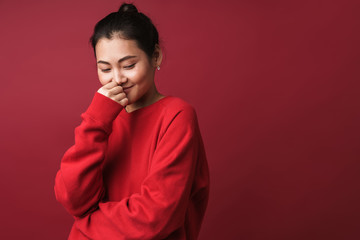 Cheerful happy young woman posing isolated