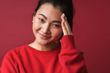Cheerful happy young woman posing isolated