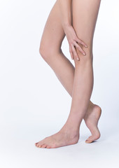 Beautiful legs and hand on a white background