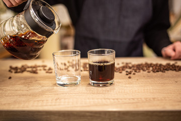 Cropped shot of barista preparing coffee in coffee shop copy space, stock image, top list