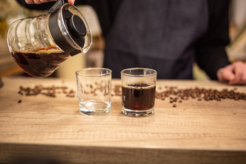 Cropped shot of barista preparing coffee in coffee shop copy space, stock image, top list