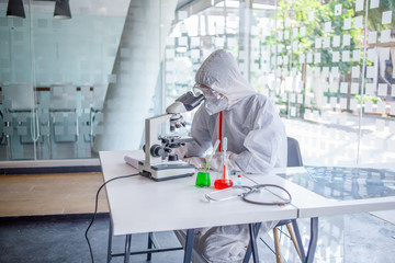 coronavirus covid 19, medical looking through a microscope for Corona Virus in laboratory for Prevention of pandemic, biological protective Epidemic virus outbreak concept.