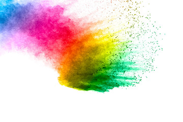 Colorful background of pastel powder explosion.Multi colored dust splash on white background.Painted Holi.