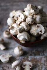 Fresh raw champignons in a bowl.