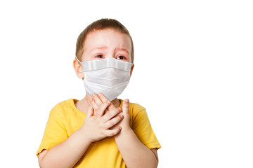 worried child wearing a protective face mask to prevent corona virus infection or pollution on...