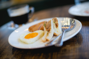 Sandwiches, Fried Eggs and Sausages Breakfast for hotel guests