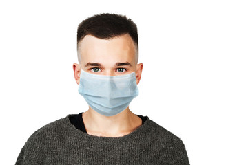 Sick guy looking at the camera with a surprised medical mask. Virus protection during influenza epidemic. corona virus