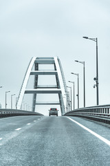 Crimean bridge. Russia. The car goes through the arch of the Crimean bridge.Black and white image