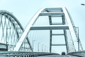 Crimean bridge. Russia. The car goes through the arch of the Crimean bridge.Black and white image