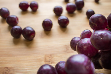 Grape on top of a wooden board