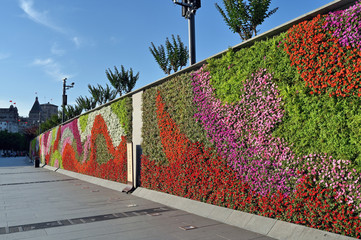 Decorative wall with colorful flowers and plants on the Bund of Shanghai，china