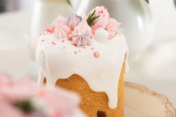 Close up view of delicious Easter cake with white glaze and meringue