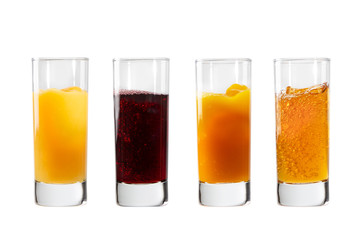 Glasses with orange, cherry, sea buckthorn and apple juices