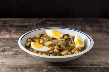 Chickpea stew with spinach and cod or potaje de vigilia. Typical spanish food for Easter holidays.	