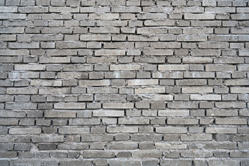 Rough dark gray building brick wall background
