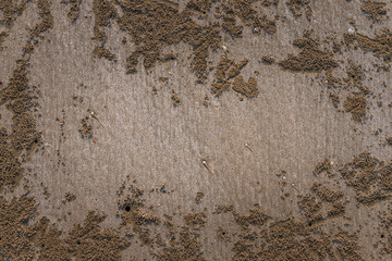 Closeup of sand pattern of a beach in the summer.