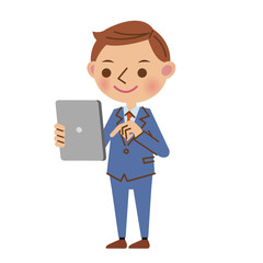 タブレット端末を使う若いビジネスマン