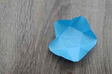 A folding paper origami star