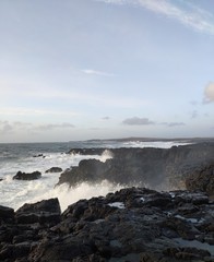 waves crashing into cliffs