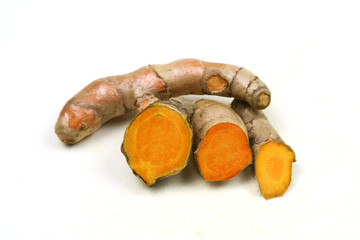 Fresh turmeric root isolated on a white background is an ingredient in turmeric foods and...