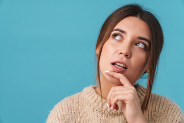 Image of serious caucasian woman thinking and looking upward
