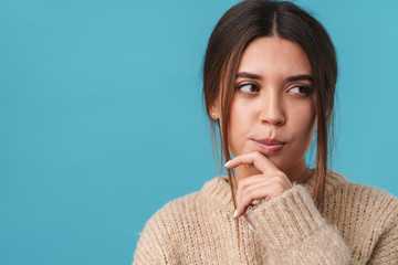 Image of serious caucasian woman thinking and looking aside
