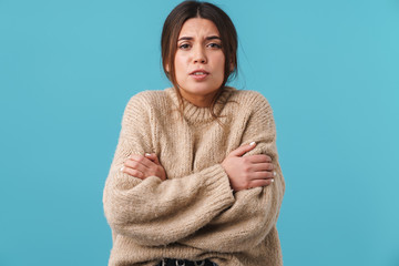 Image of unhappy caucasian woman posing with hands crossed