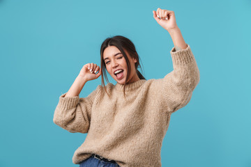 Image of cheerful caucasian woman winking and dancing