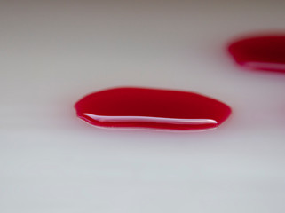 Red blood drops on the white