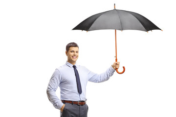 Elegant young man holding an umbrella and smiling