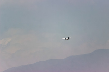 The plane is flying in the clouds, copy space for design. blurring the photo is my idea