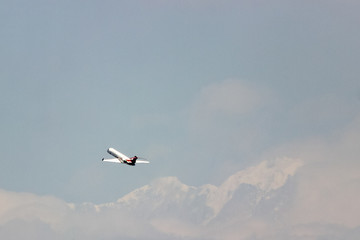 The plane is flying in the clouds, copy space for design. blurring the photo is my idea