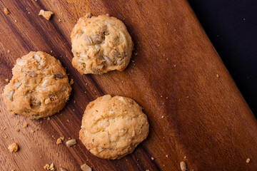 Cookies is on wooden plate. Top view