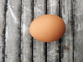 chicken eggs on a bamboo board