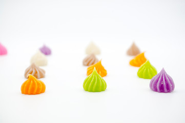 A-Lua, colorful Thai style dessert look like mini meringue cookies isolated on white background.