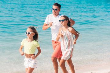 Father and kids enjoying beach summer vacation