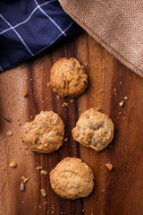 Cookies is on wooden plate.  Top view