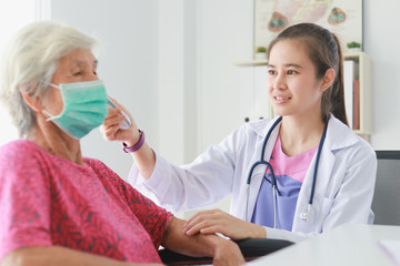 Asian Old Patient woman  Talking with Medical Doctor women in clinic office hospital