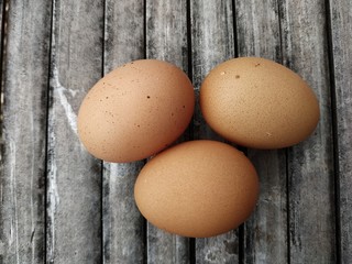chicken eggs on a bamboo board