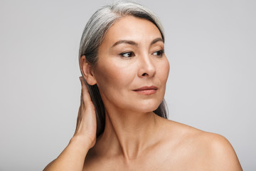 Beauty portrait of an attractive mature topless woman