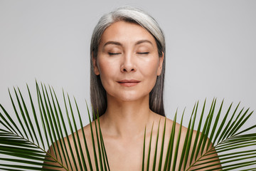 Beauty portrait of an attractive mature topless woman