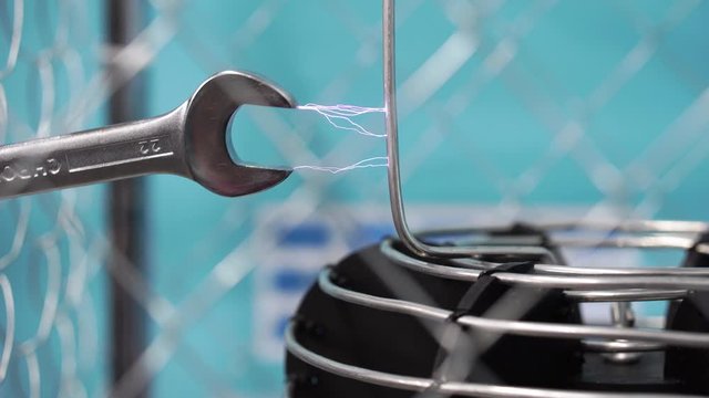 Demonstration of electrical discharges in a tesla coil. 4K video, close-up.