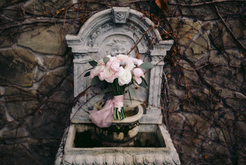 Gorgeous wedding flowers on a rock