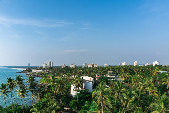 Kerala Travel and Tourism Concept Image, Amazing Panoramic nature view of Kannur, Best place to visit, Green Coconut Trees with blue sea and sky